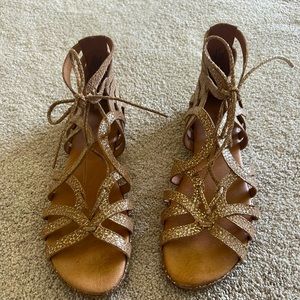 Tan/metallic like new sandals. Cushion insole.